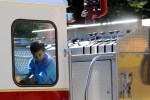 A youngster gets a chance to climb all over a Yulan fire apparatus…it’s for sale next year.