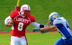 DSC_0010 Ellenville’s top gun Doug Lewis closes in on Liberty QB Marshon Williams.