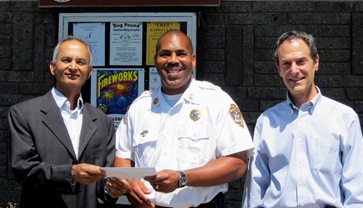 Donation to police department by SYDA Foundation 2010; Kamal Dugiralla, Chief Simmie Williams, Chris Williams
