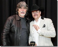 John Rich accepting the Angels Among Us Award from Randy Owen — with John Rich