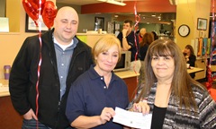 Chris and Miranda present the Fallsburg Lions Club check