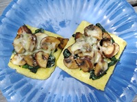 Close-up grilled polenta with mushrooms, spinach, fontina, and truffle oil_reduced size